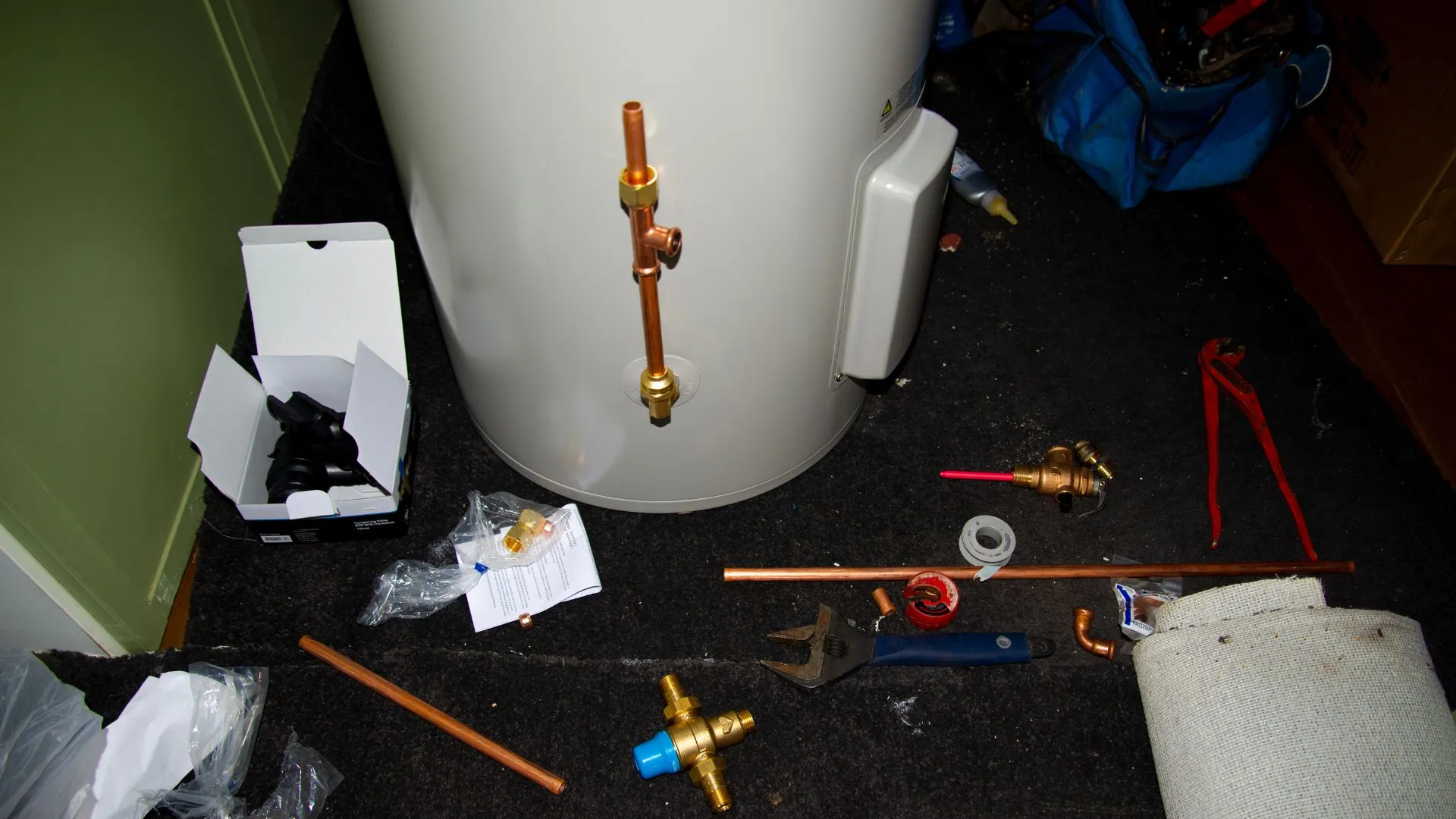 Gas water heater with seismic straps and expansion tank in a San Mateo garage