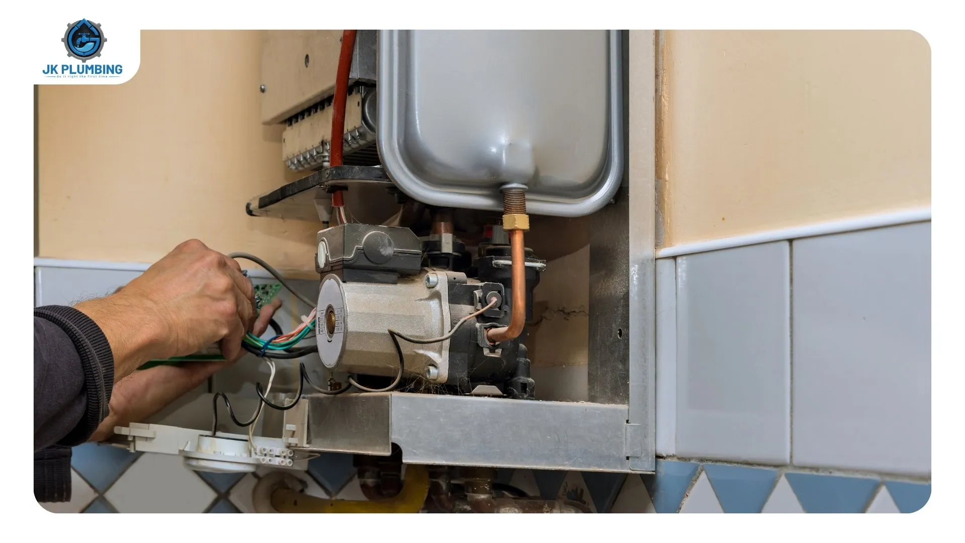 JK Plumbing plumber running an error-code diagnostic on a wall-mounted tankless water heater in a Sunset District utility closet