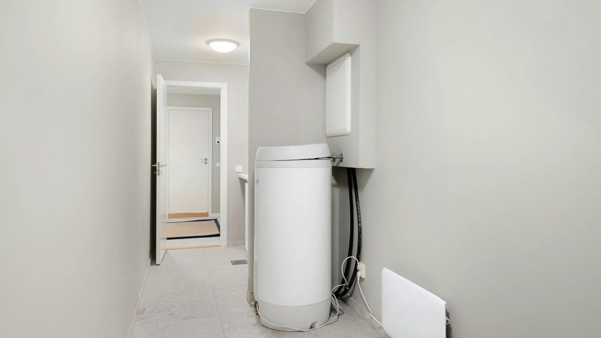 K Plumbing technician replacing a 50-gallon water heater in a South San Francisco garage