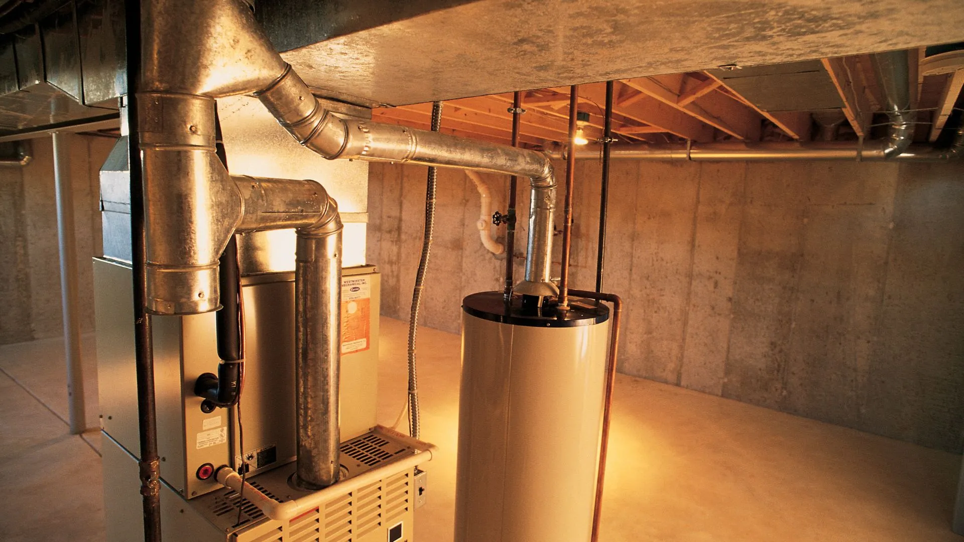 Wall-mounted tankless unit installed where a tank water heater previously stood in a San Francisco home