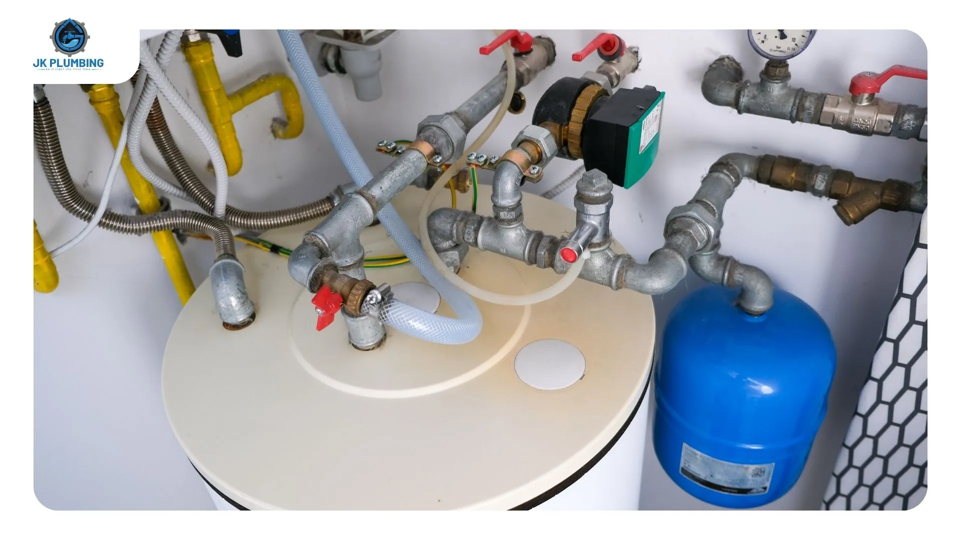 Gas water heater in an interior hallway closet with combustion air vents near the top and bottom of the door